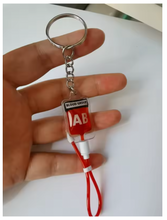 Cargar imagen en el visor de la galería, Llavero de PVC con diseño de bolsa de sangre tipo A, B, O, AB